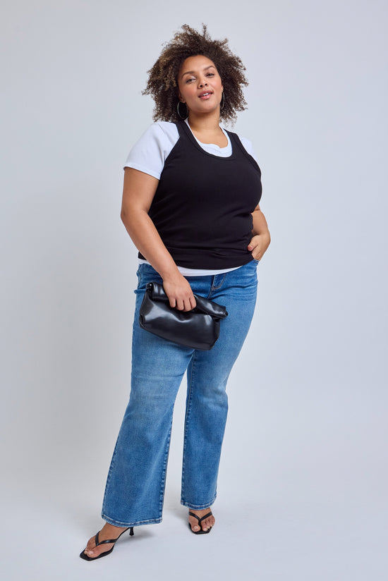 woman wearing a with t-shirt with a blank tank over it and blue jeans | model-size: 16