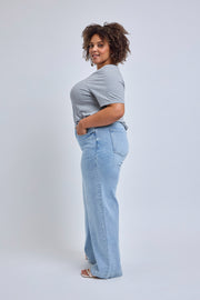 Person wearing a light blue t-shirt and jeans on a white background