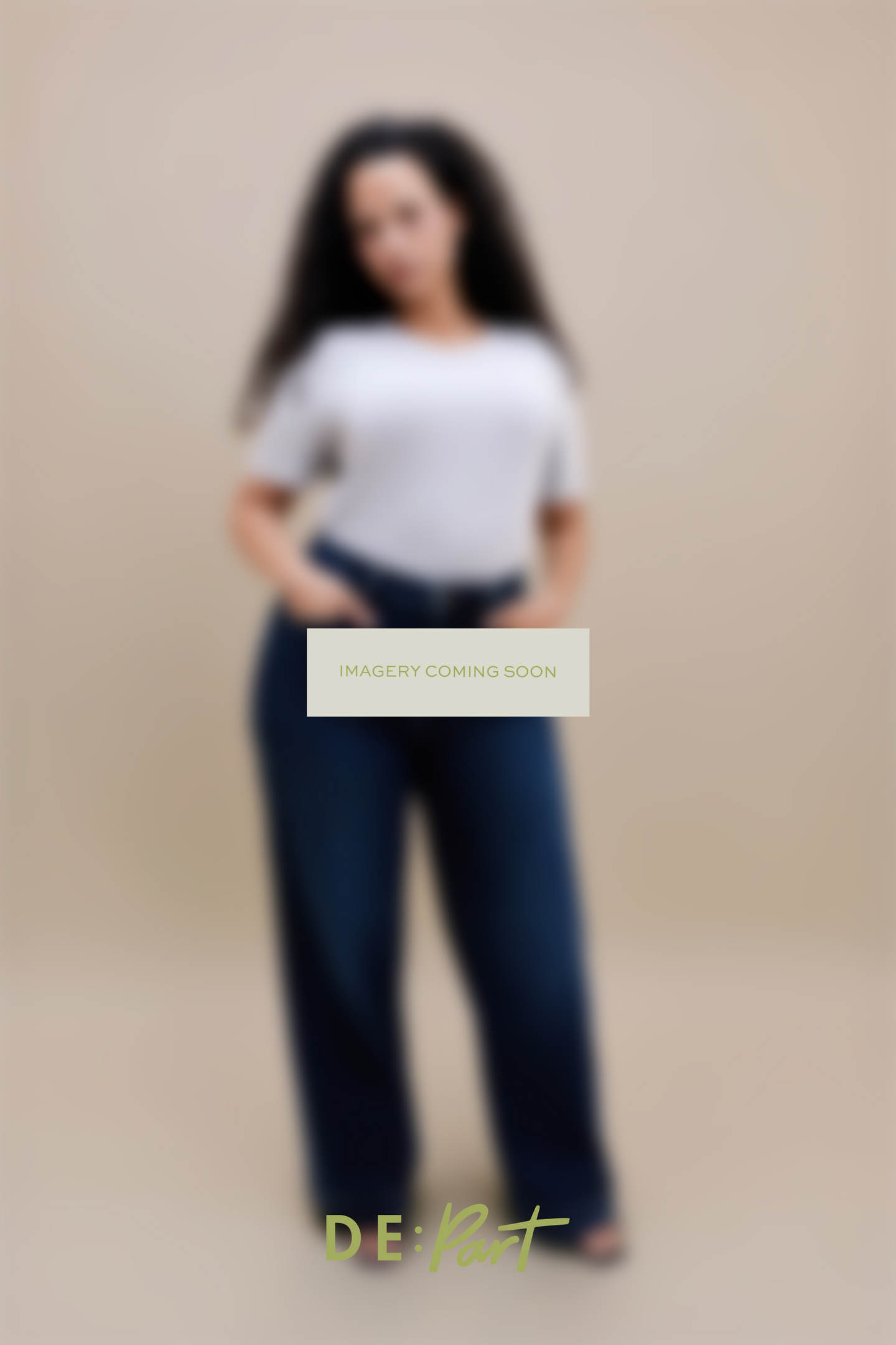 A blurred studio photo of a person wearing a white short-sleeve top and dark blue wide-leg pants against a warm beige background, with a central 'IMAGERY COMING SOON' overlay and 'DE:Part' branding at the bottom.