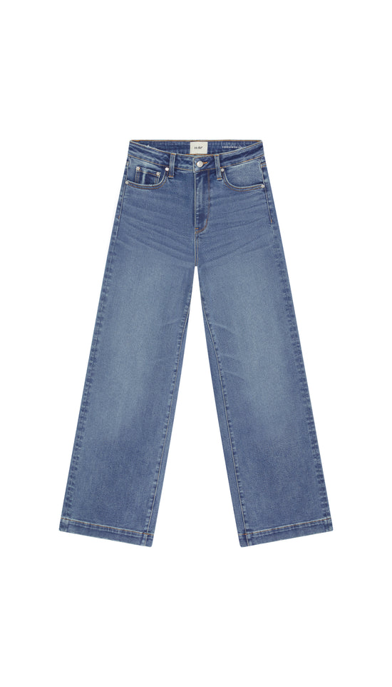 Wide leg medium blue jean flat on white background.