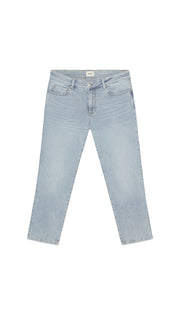 Light blue skinny jeans flat on a white background