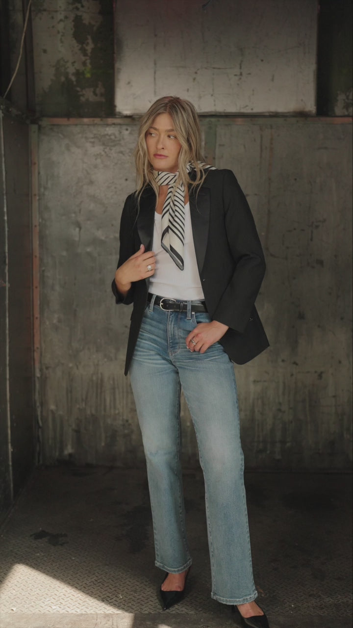 Video of a women wearing a blazer over a Depart with tank and medium wash denim