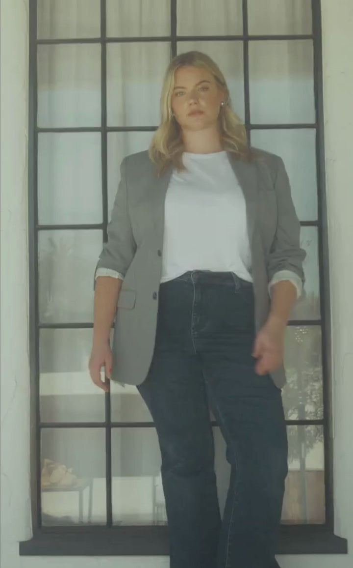 Inclusive women’s dark denim in motion in an outside location